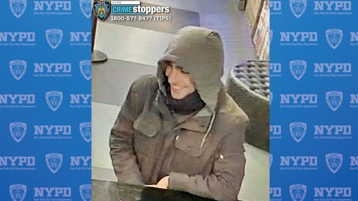 A screenshot from surveillance footage released by the NYPD shows an alleged person of interest wanted in connection for the shooting death of UnitedHealthcare CEO Brian Thompson