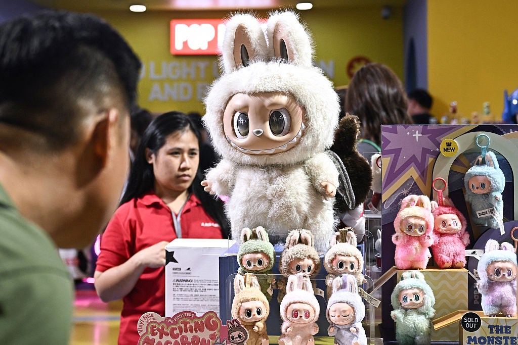 People look at collectable designer art toy Labubu at a Pop Mart pop-up store in Siam Center shopping mall in Bangkok on 6 May 2025